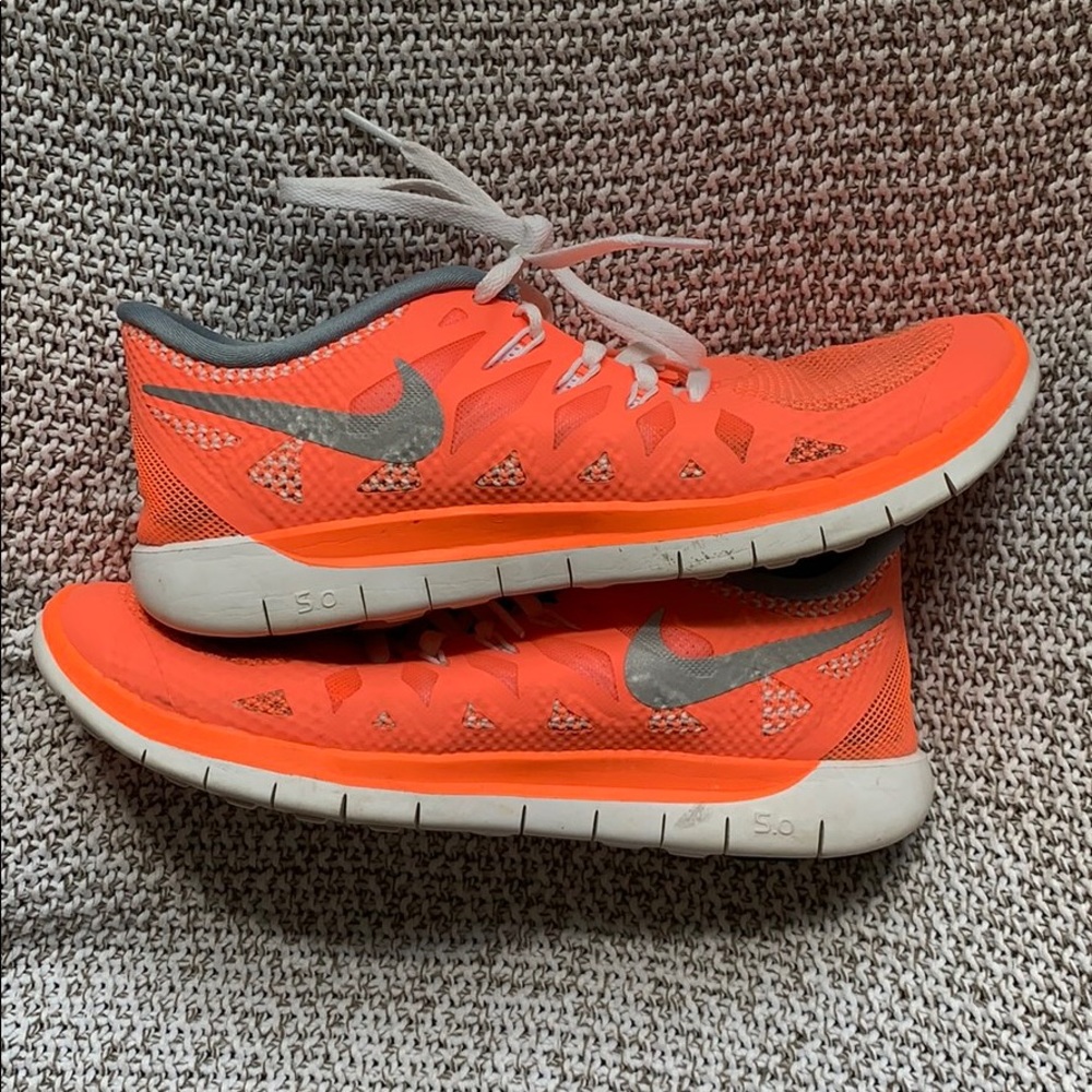 Coral Nike sneakers